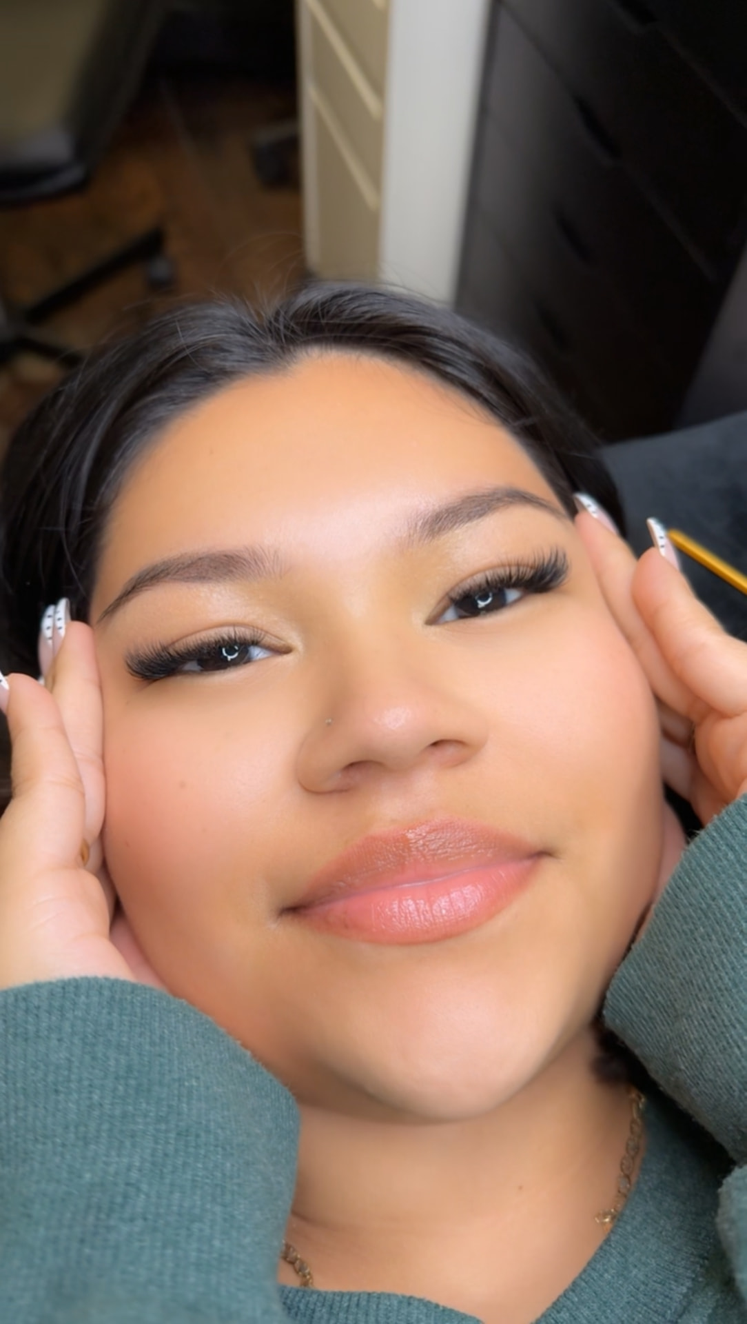 Mahogany client smiling after her lash appointment